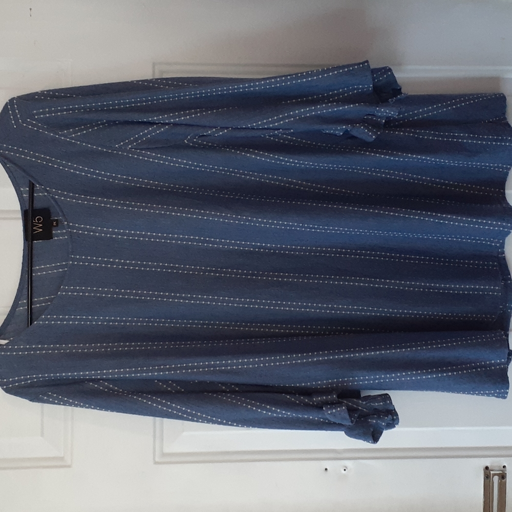 Blue blouse with white dotted lines